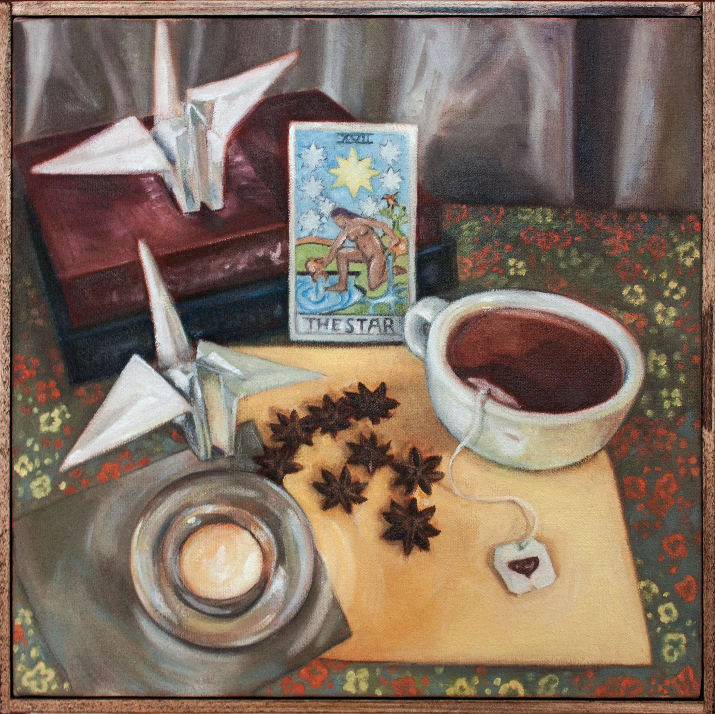 Painting of the Star tarot card, cup of tea, two paper cranes, two books and a candle.
