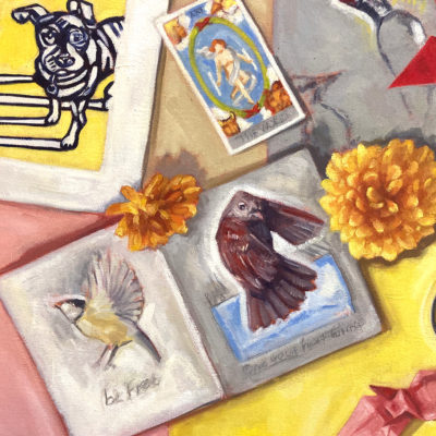 detail of Artifacts painting: print of a dog, and sketchbook open show two pages with bird sketches, Tarot cards: The World.