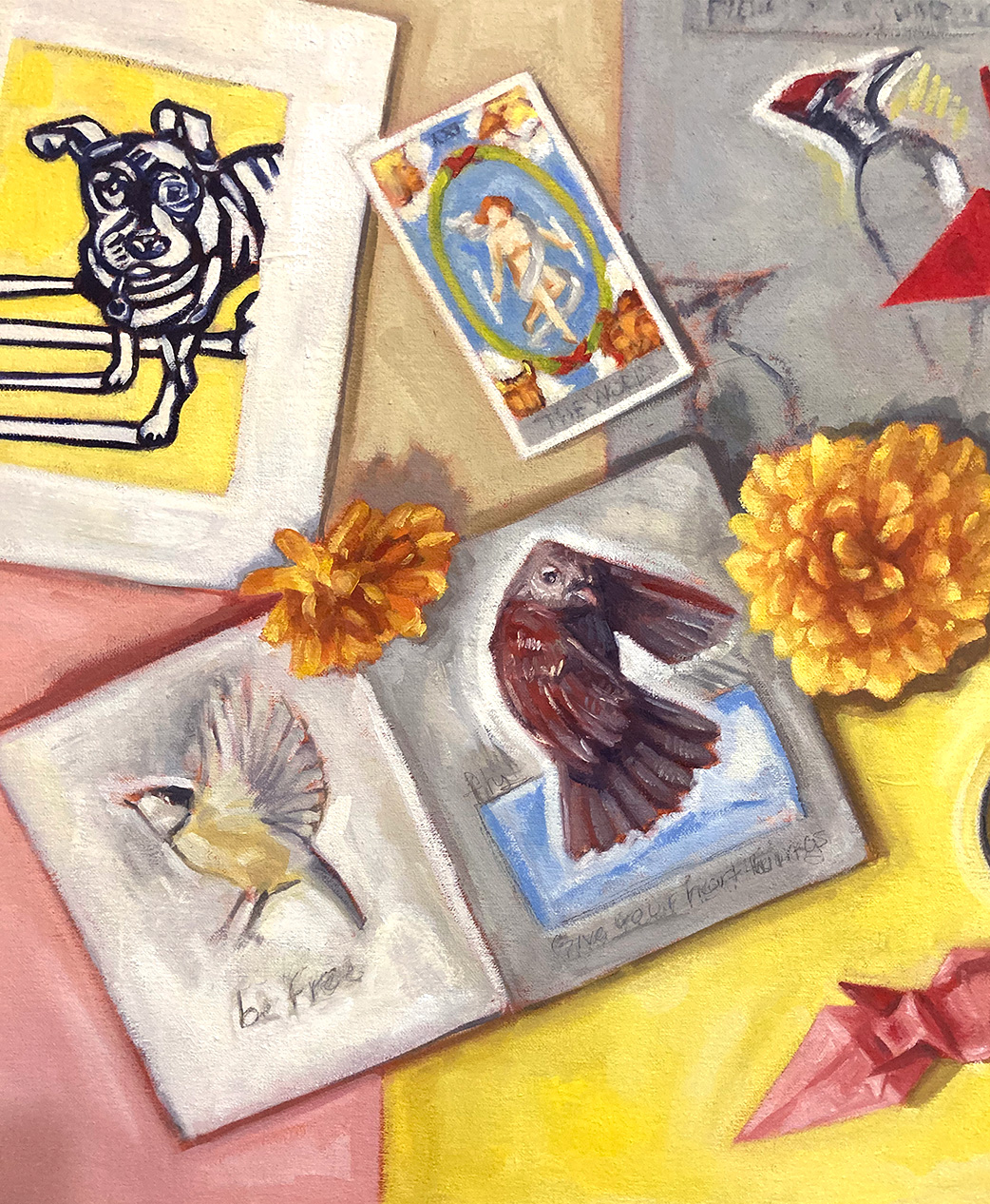 detail of Artifacts painting: print of a dog, and sketchbook open show two pages with bird sketches, Tarot cards: The World.