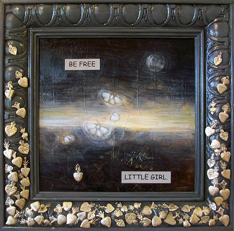 An Image of two small moths flying into the dawn. The words "Be free" in the upper left corner. The frame around the image is tacked with small flaming heart charms.